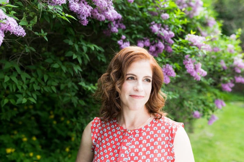 Portrait of Sara Smeaton in her garden, photographed by Amber Ellis